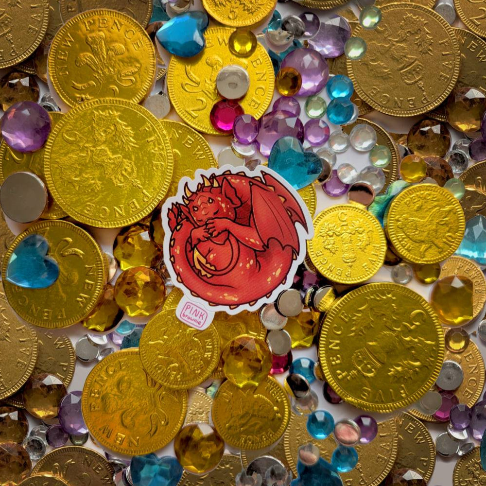 Gold coins and colorful gemstones with a sticker featuring a sleeping red dragon.